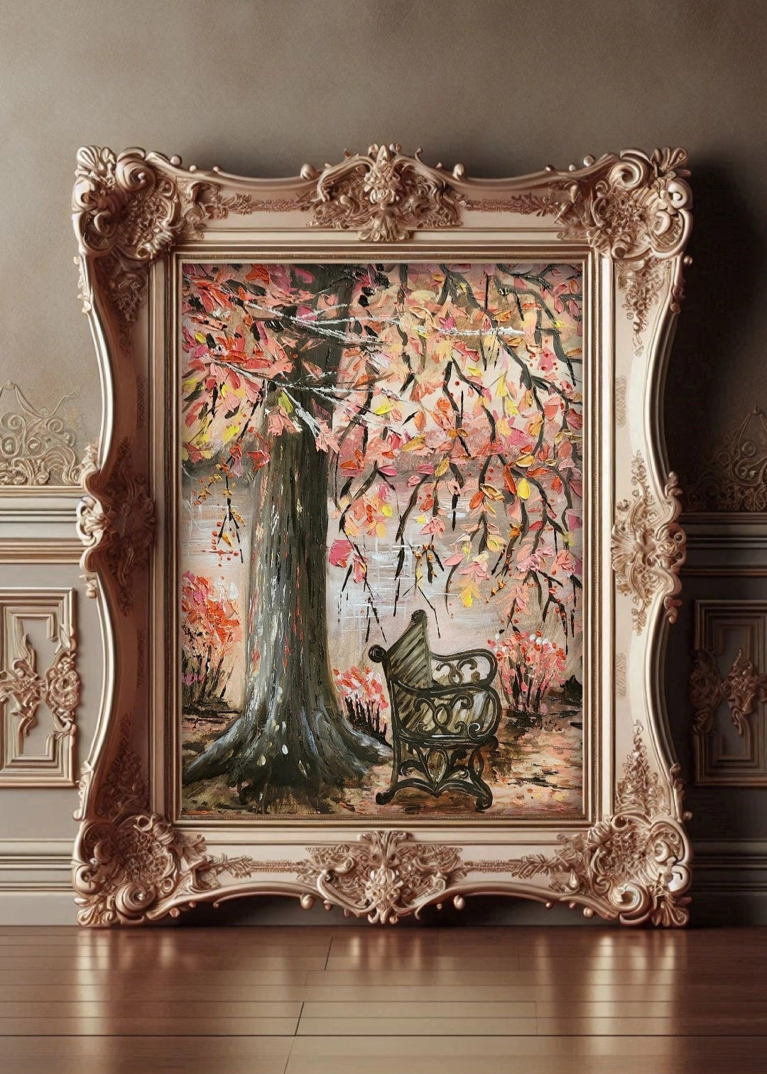 Decorative painting of a tree with birds in an ornate frame on a wooden floor.
A painting featuring an empty bench under a lonely tree stump with overhanging autumn leaves branches with a flowing river in the background. Original fine artwork. Wall decor. Interior design and decorations for home office studio, cafe. Artwork modern art.