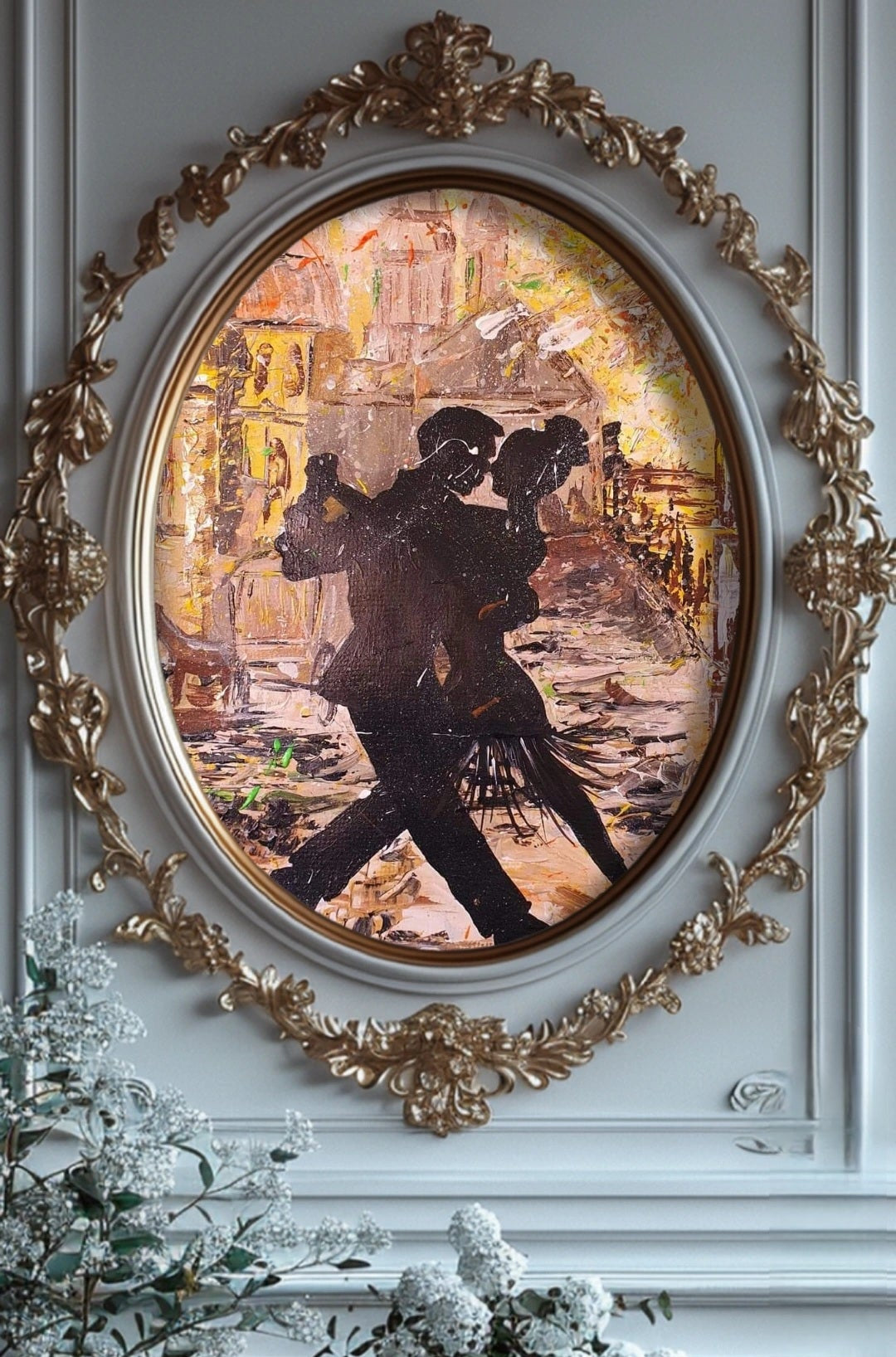 Decorative painting of a couple dancing in an ornate frame on a wall with floral decorations.