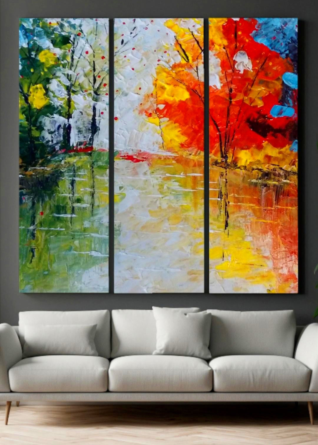 An abstract painting of red, blue trees lining a body of water with the reflections shining through. Bold pallet knife and brush strokes. Home decor. Wall art and art collectors.