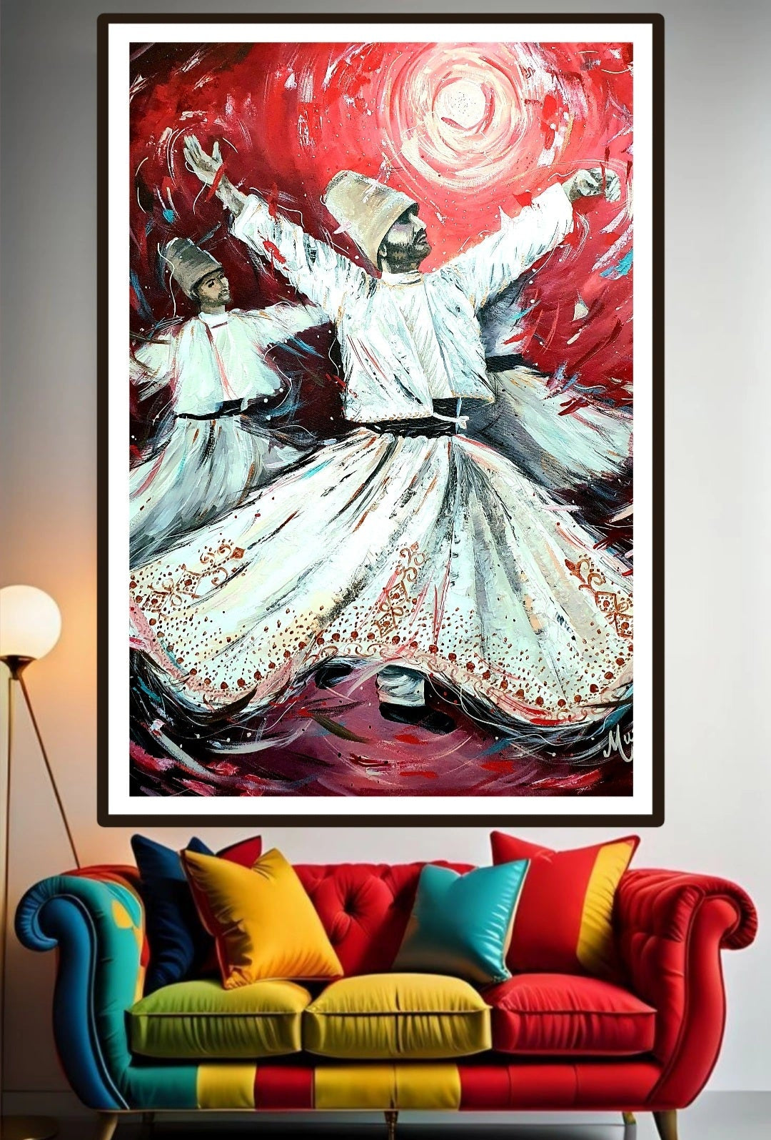 Framed artwork on the wall above a colorful sofa with cushions. A vibrant visual artwork featuring two figures in white traditional clothing whirling against a dynamic red background, expressive of the described spiritual and artistic inspirational dance of Rumi. The whirling Dervishes spinning around in a trance like meditation.
